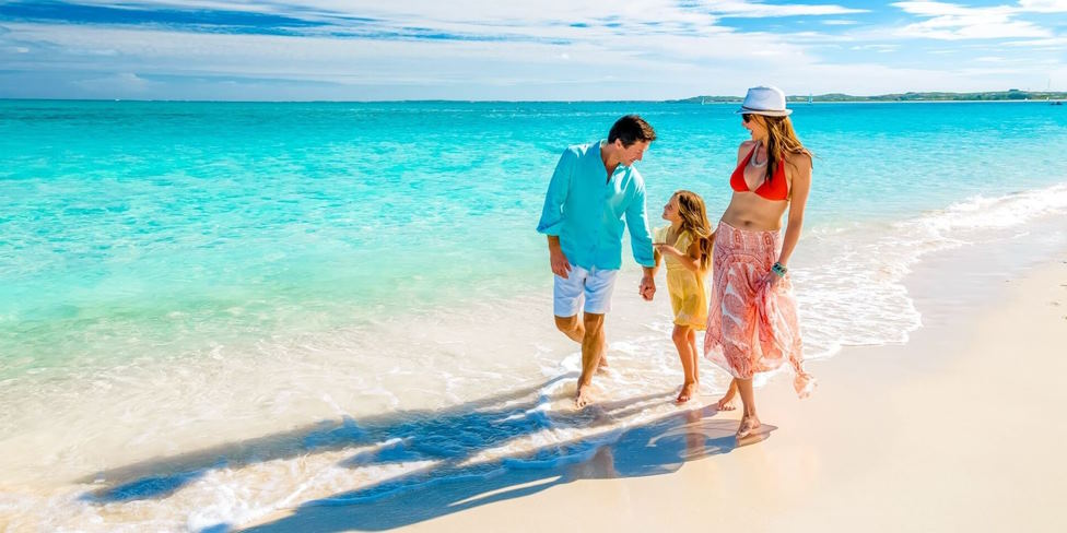 families enjoy spending time at the beach